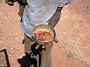 We got waylaid by a local and asked for fuel. We gave them water and they gave us honey ants to try. Very sweet.